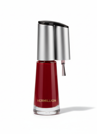 Glossy classic red nail polish bottle on white background