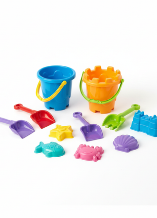 Colorful beach toy set with buckets shovels and sand molds