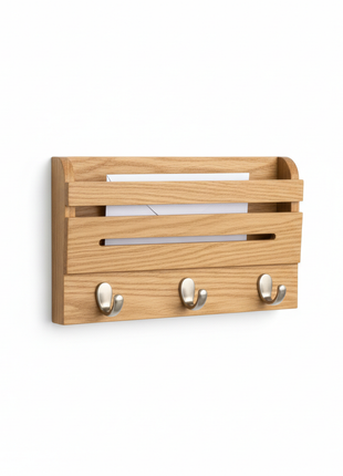 Wood and metal wall-mounted key and mail organizer on white background