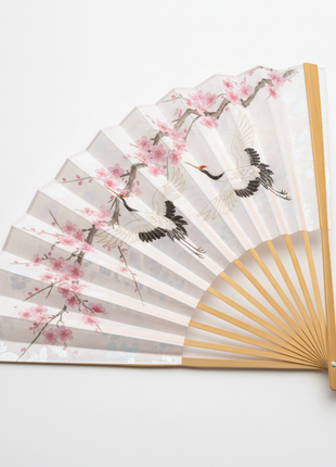 Traditional Japanese folding fan sensu with cherry blossom and crane design on silk fabric
