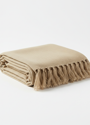 Luxury linen table runner in oatmeal beige with fringe edges
