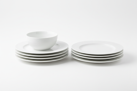Set of 6 classic white ceramic dinner plates stacked