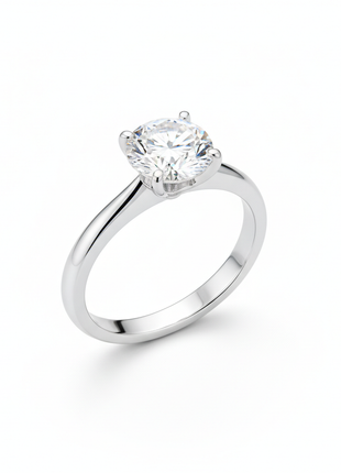 Women's diamond solitaire ring in 14K white gold on white background