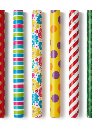 Assorted decorative wrapping paper rolls in festive patterns